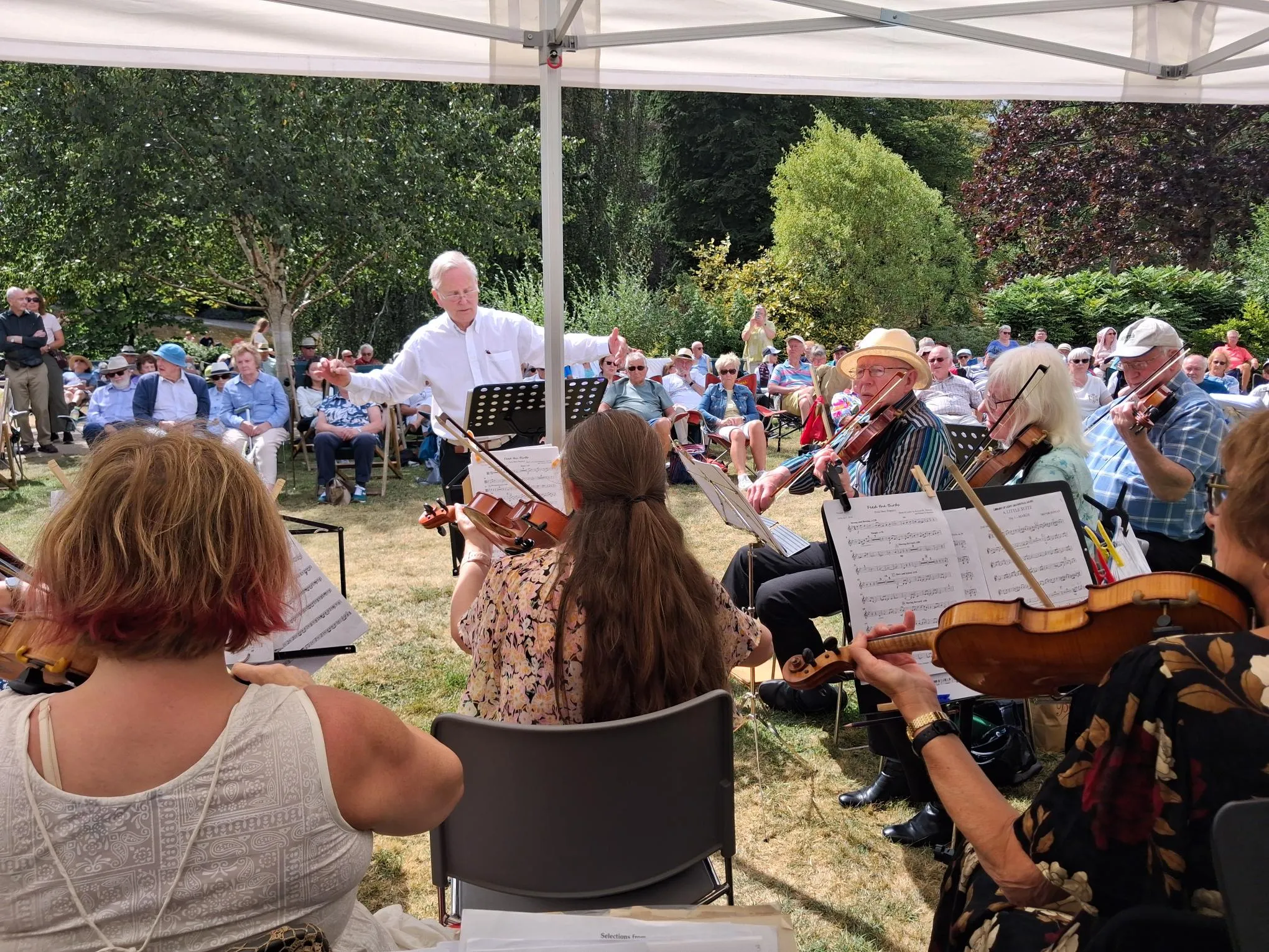 Chris Irvin conducting and orchestra playing